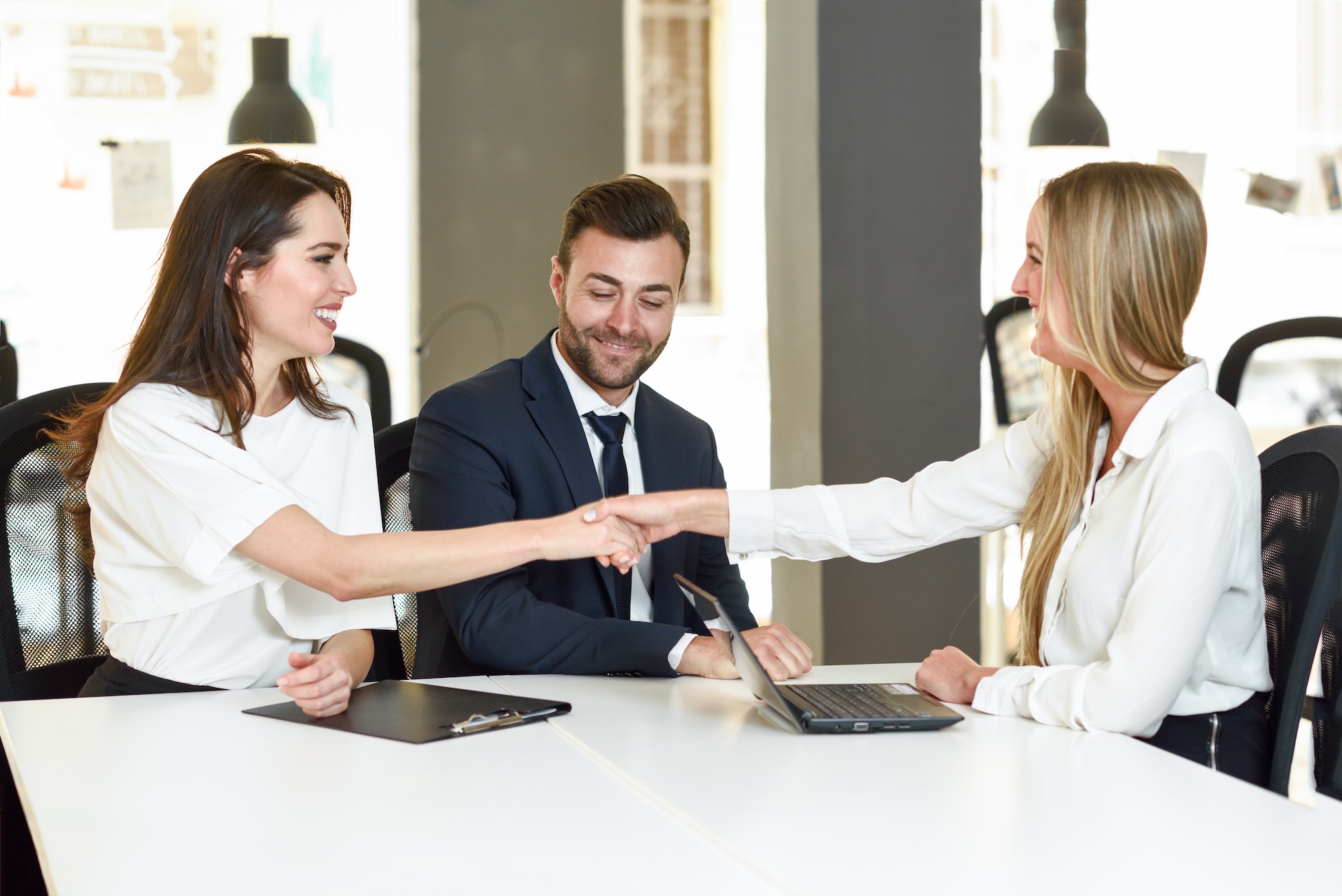smiling-young-couple-shaking-hands-with-an-insurance-agent.jpg smiling-young-couple-shaking-hands-with-an-insurance-agent.jpg